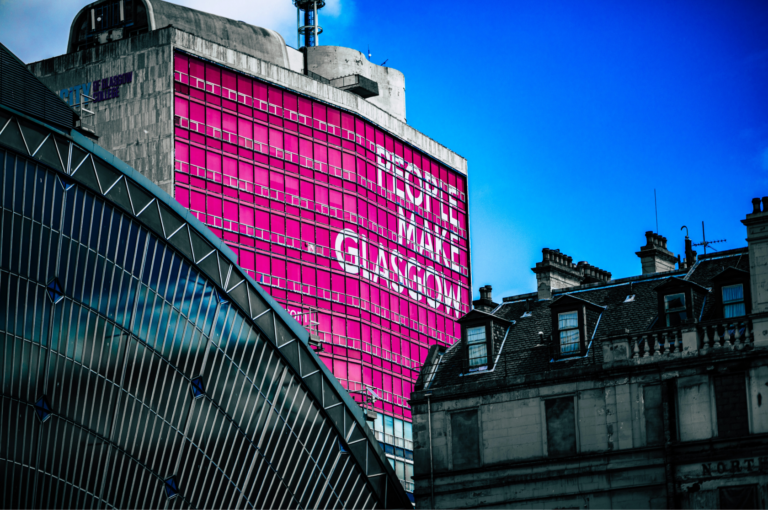 'People make Glasgow' written on the side of a building