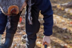 A child explores outdoors. Edmonton, Nova Scotia, & PEI Wild Child Forest Schools