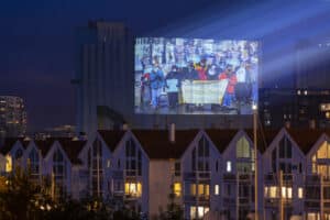 Projection against Equinor's Bay du Nord in Stavanger, Norway. Page: Climate Change Myths