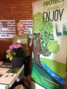 A Peel Group Sierra Club Canada Volunteer at a table. Page: Grow our Greenbelt Ontario.