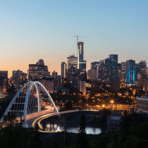 Edmonton at night with the bridge in the foreground. Indigenous led walks in Edmonton.