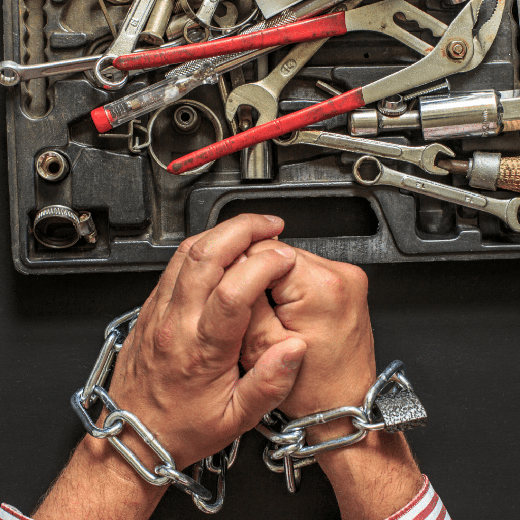 Right to Repair Canada. Shows hands chained to prevent them from repairing something with tools.