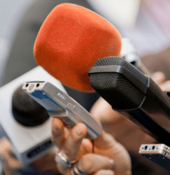 Supporting Independent Journalism and Media in Canada. Picture of microphones at an interview.