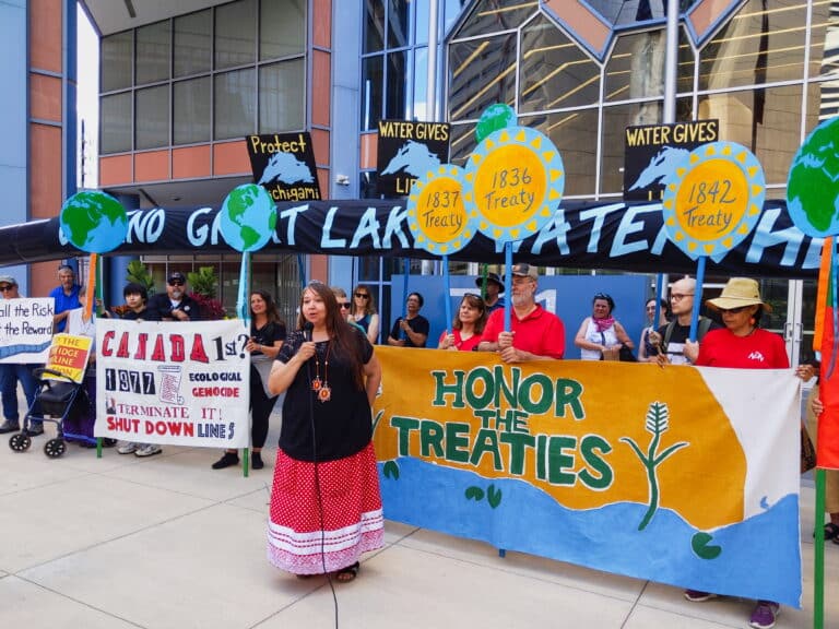 Minnesota and Wisconsin residents calling on Canada to retire the Enbridge Line 5 oil pipeline rally outside the Canadian consulate office.
