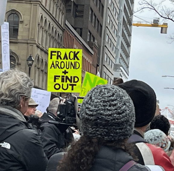 photo of people at a rally. Pages: New Brunswick Gas Plant