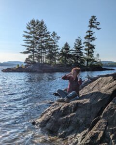 Photo of Danielle Romaine at a lake